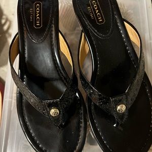 Coach sandals 2.5” platform. Unworn, scuff marks on sole as it’s a floor model.
